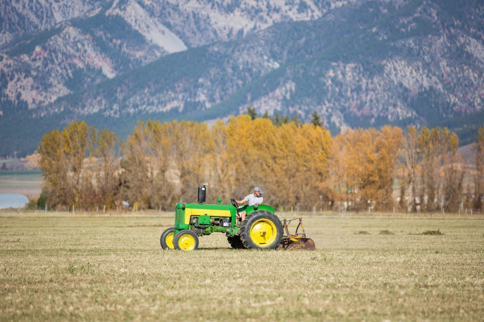 John Deere 435 with mountains
