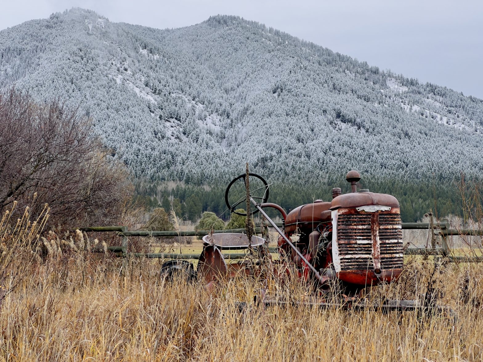 Farmall Model A with snow-capped mountains